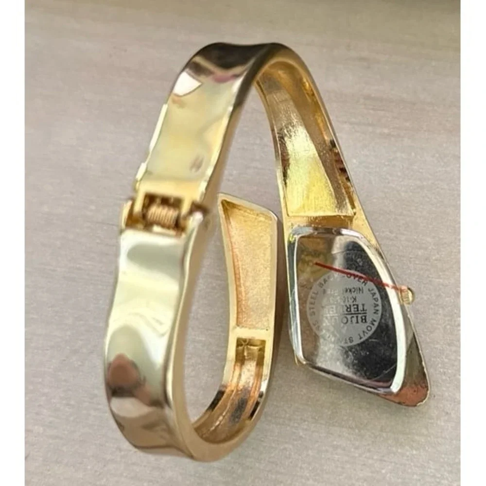 Bijoux Terner Women's Retro Gold Tone asymmetrical cuff watch with black accent